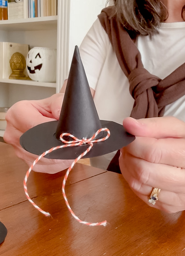 Mini paper witch hat with orange and white twine bow