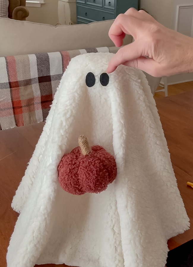 Adding felt eyes to a sherpa ghost