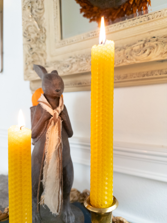 Close up of two rolled beeswax candle that are burning