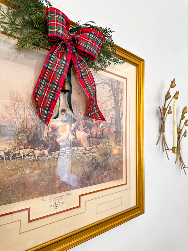 Equestrian art with Christmas plaid ribbon bow and greenery to get the Ralph Lauren Christmas look.