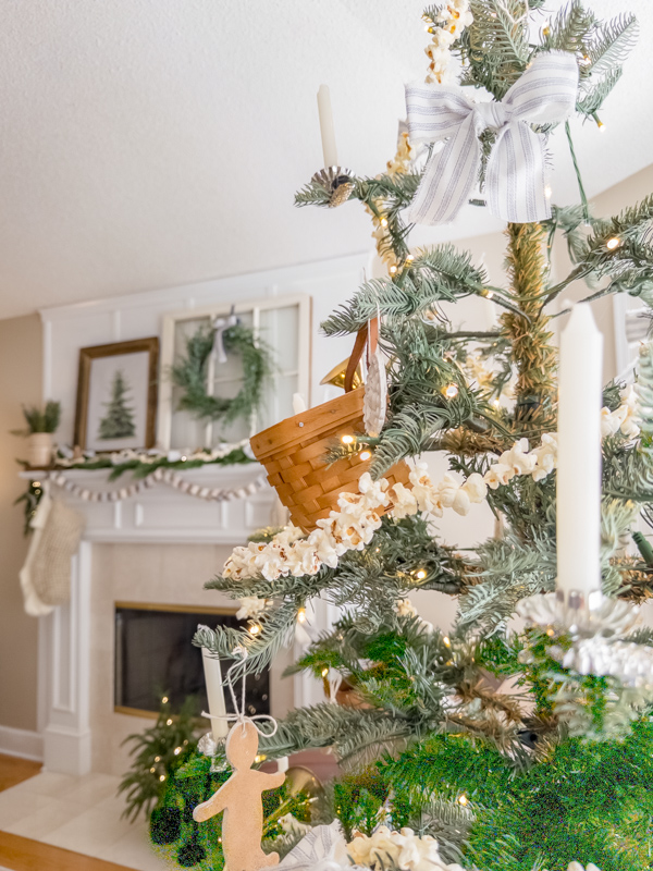 Little House inspired Christmas tree and mantel. Gingerbread cookie ornaments made from air dry clay, baskets, candles on the tree. Old window, wreath, garlands , crocks and stockings on the mantel.