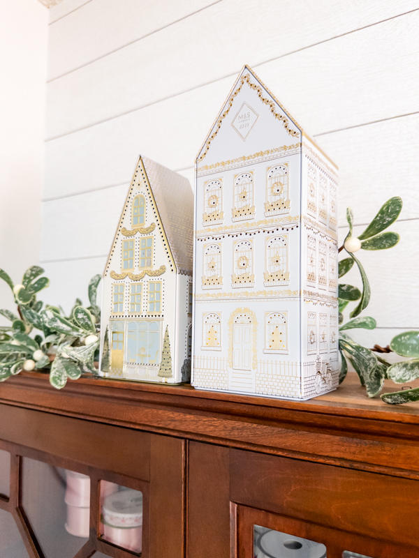 Marks and Spencer houses on secretary with christmas garland