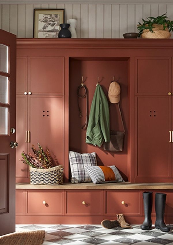 Glidden paint color of the year warm mahogany painted on a cabinet in a mudroom