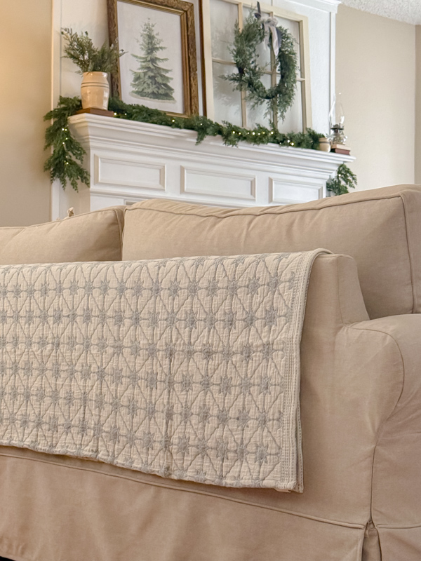 Simple Winter Decor using a blanket on the back of a sofa