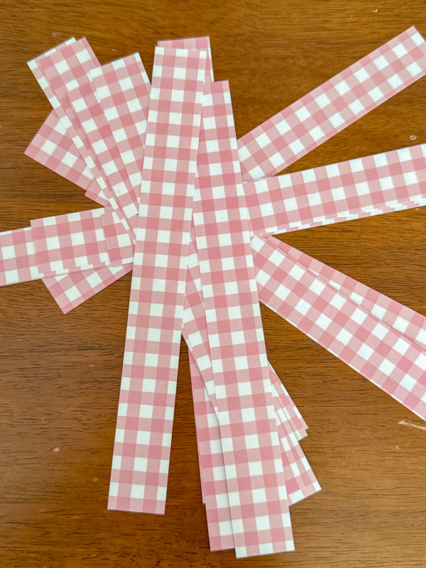 Pink and white check paper strips