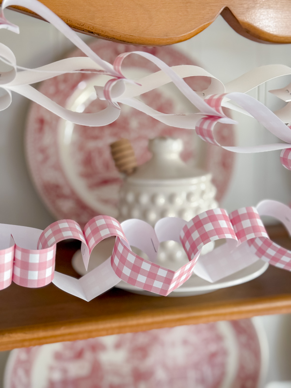 Close up of a pink and white gingham heart chain