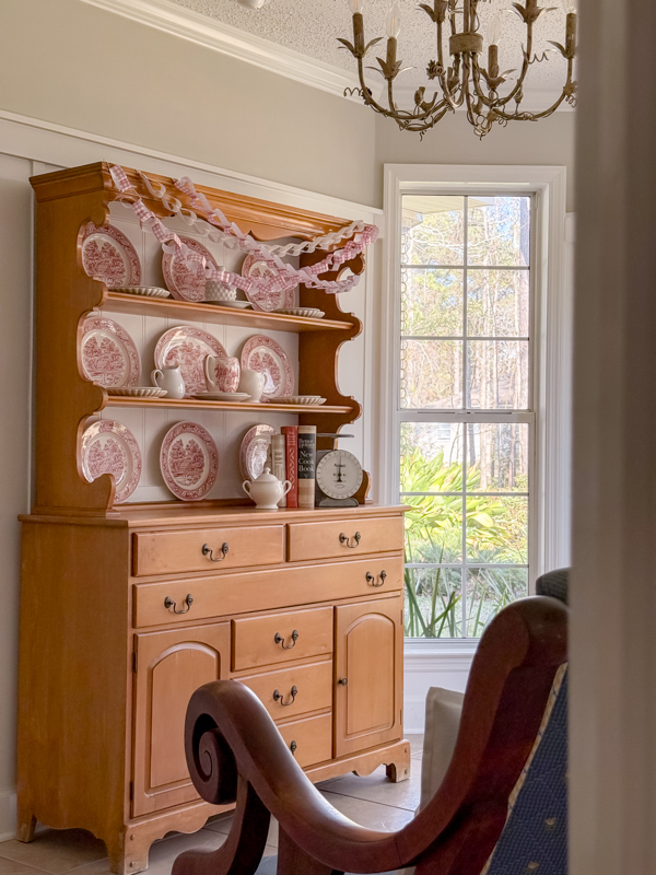 Kitchen sitting room decorated for Valentine's day with heart paper chains.