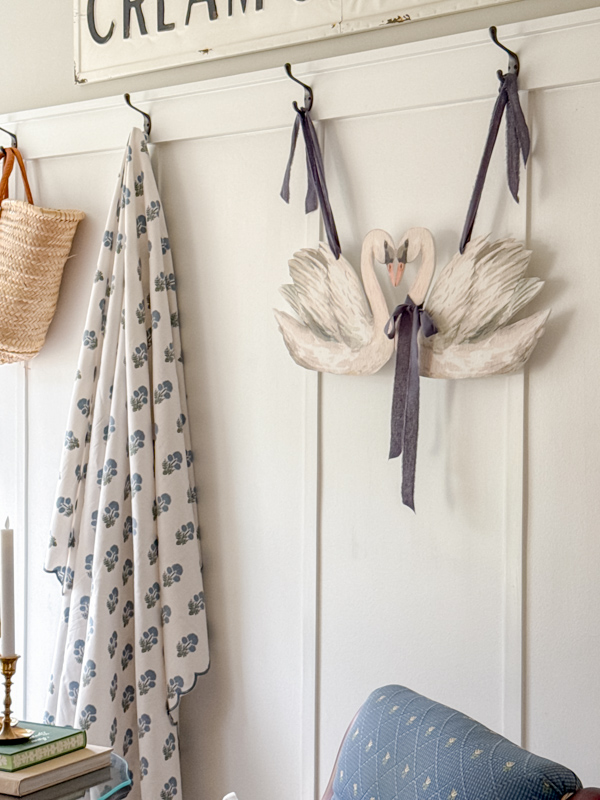 Spring swan printable art decorating hanging on a wall.