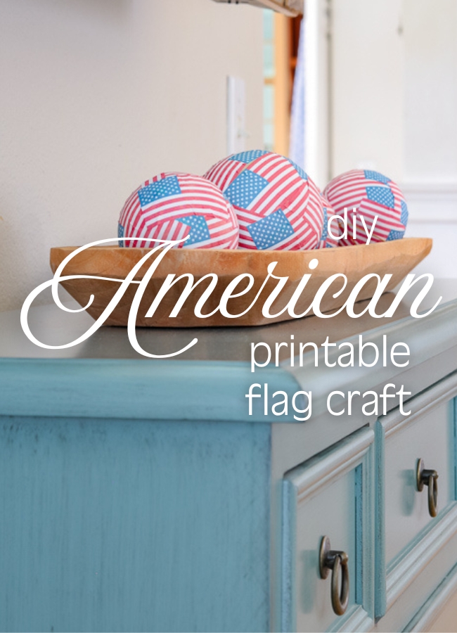Photo of a dough bowl full of American flag decoupaged round orbs or balls and writing over it that says DIY American printable flag craft