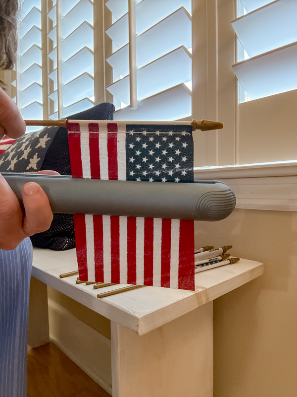 Ironing a American stick flag with a hair straightening iron