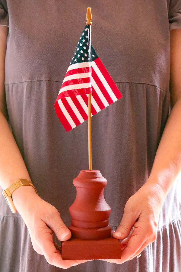 DIY American flag stand using Lowes items - furniture foot and rosette.