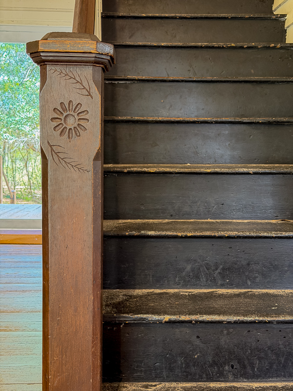 Flower and wheat design on a newell post on the stairs at Belleview. A simple but beautiful design idea for a new build.