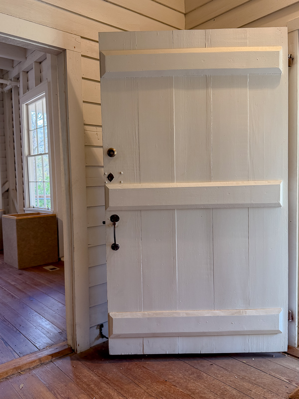 Handmade door at Belleview of thick wood and cross beams. If you want a new home to look old add interior and exterior doors like this.