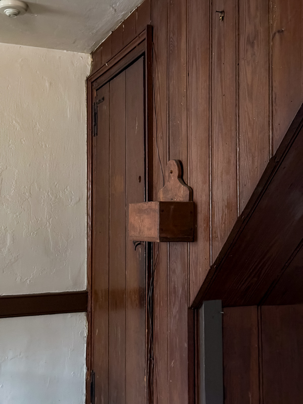 Old stained wood shiplap wall and door. Perfect idea for a newer home.