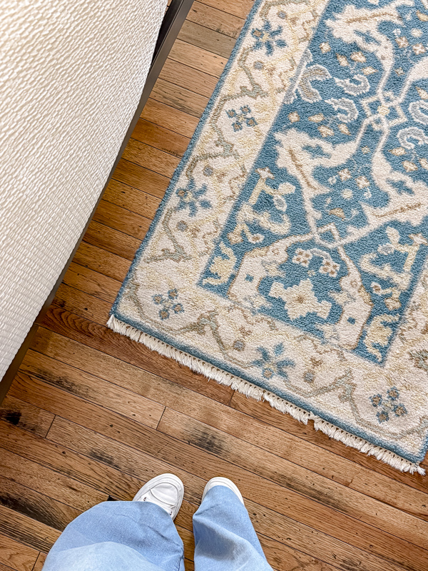 Oak wood floor with a vintage rug on it.