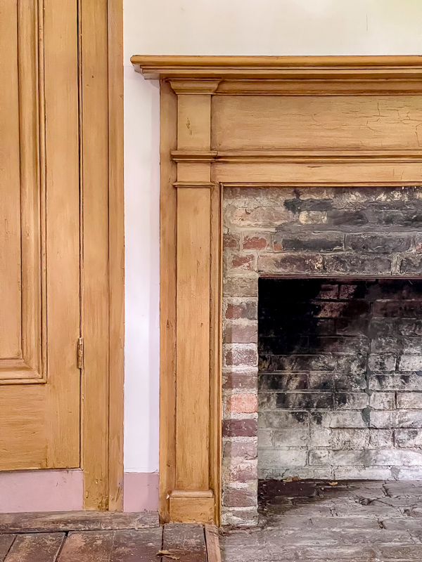 Simple fireplace mantel design for a newer home to make it look older. This idea came from the Carter house. Wood trim boarding around a brick fireplace box.