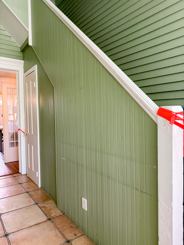 Exterior beadboard and shiplap walls painted in a beautiful vibrant green. Great idea for a new home.