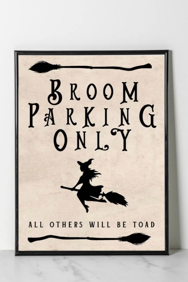 Broom Parking Only printable Halloween sign with a witch flying on a broom.